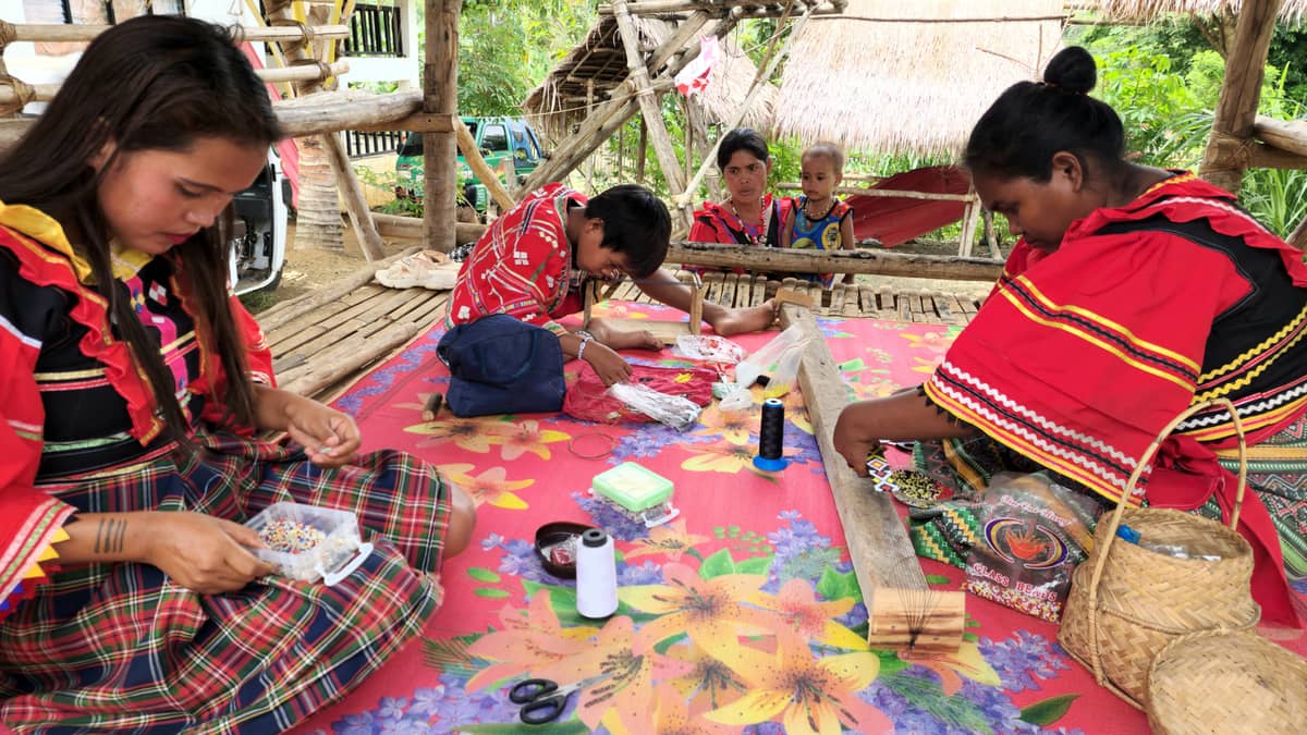 Matigsalug Manobo community of Sinuda, Kitaotao, making beaded ornaments.